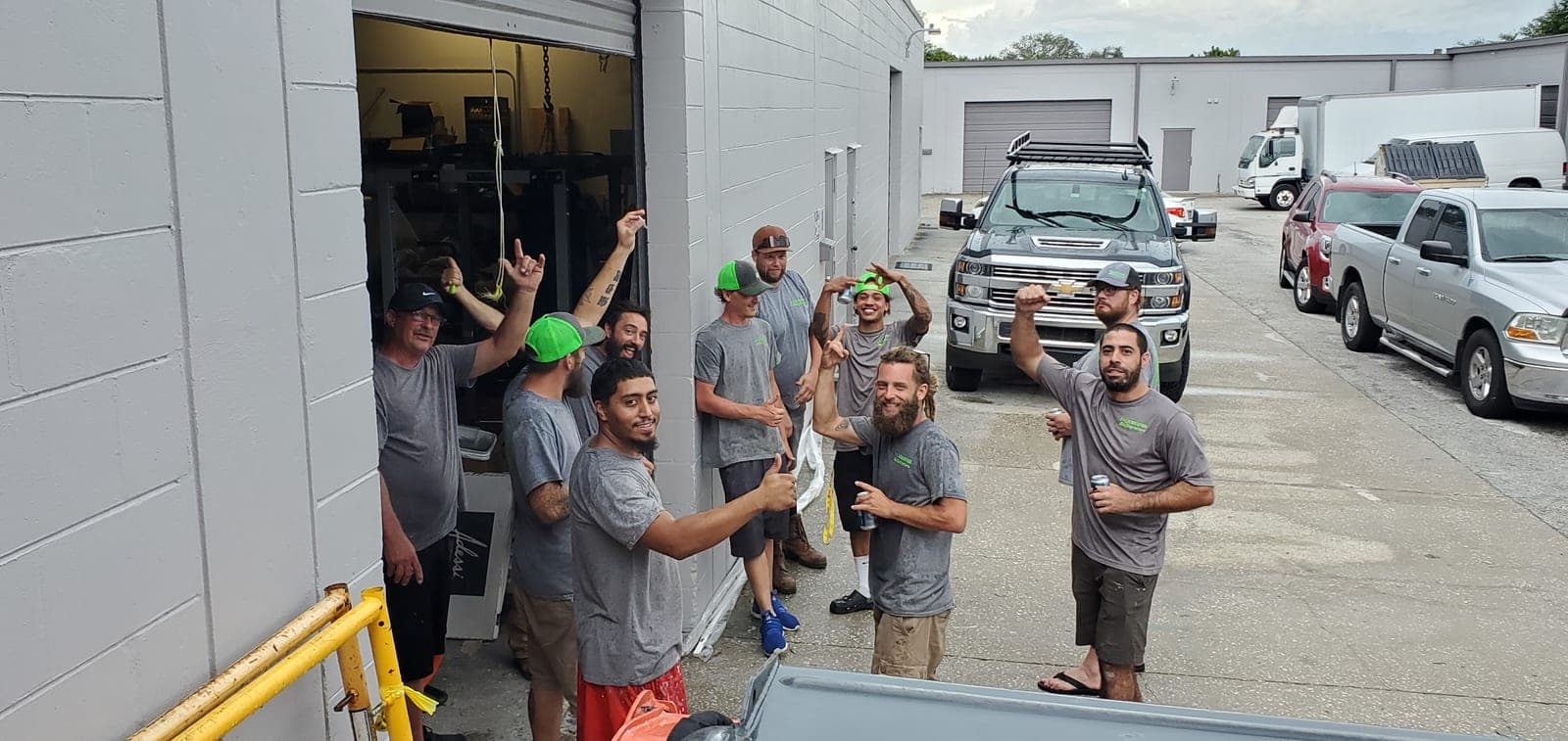 The Revolution Contractors / Contractors On Call crew gathered outside the St. Petersburg shop